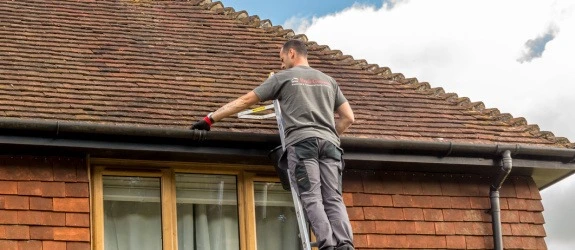 our team cleaning the gutters on a house in Stoke Bishop, Northampton